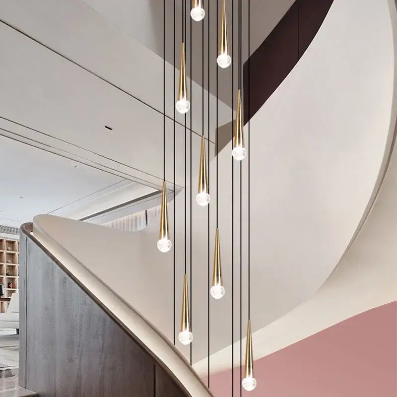Modern black conical crystal led staircase chandelier featuring gold-toned pendant lights with clear glass globes decorbites crystal led