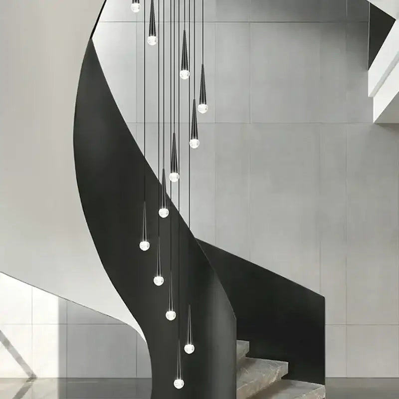 Modern black conical decorbites crystal led chandelier staircase light with sleek metal railings and white tiled walls