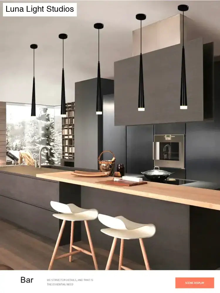 Five sleek black modern conical led pendant lamps with tapered shades hang above a kitchen island