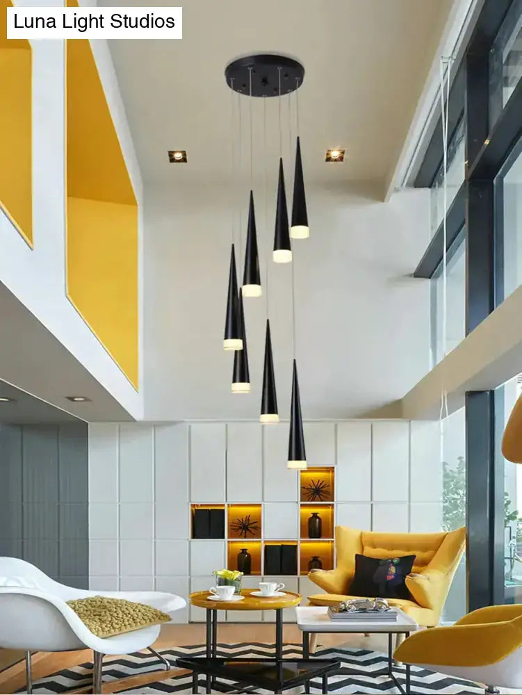 Modern black conical led pendant lamp with warm white illuminated interiors hanging from circular fixture for kitchen island