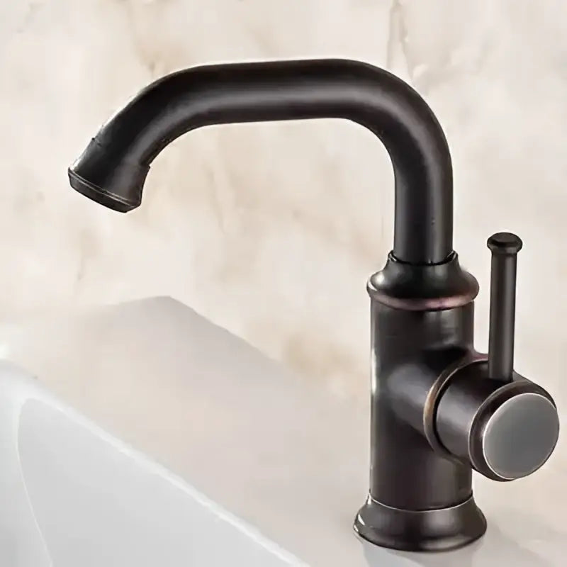 Modern black antique brass basin faucet with black matte finish curved spout and single lever handle by decorbites