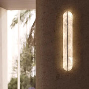A sleek modern black copper marble led wall light with a translucent white body for living room decorbites black copper
