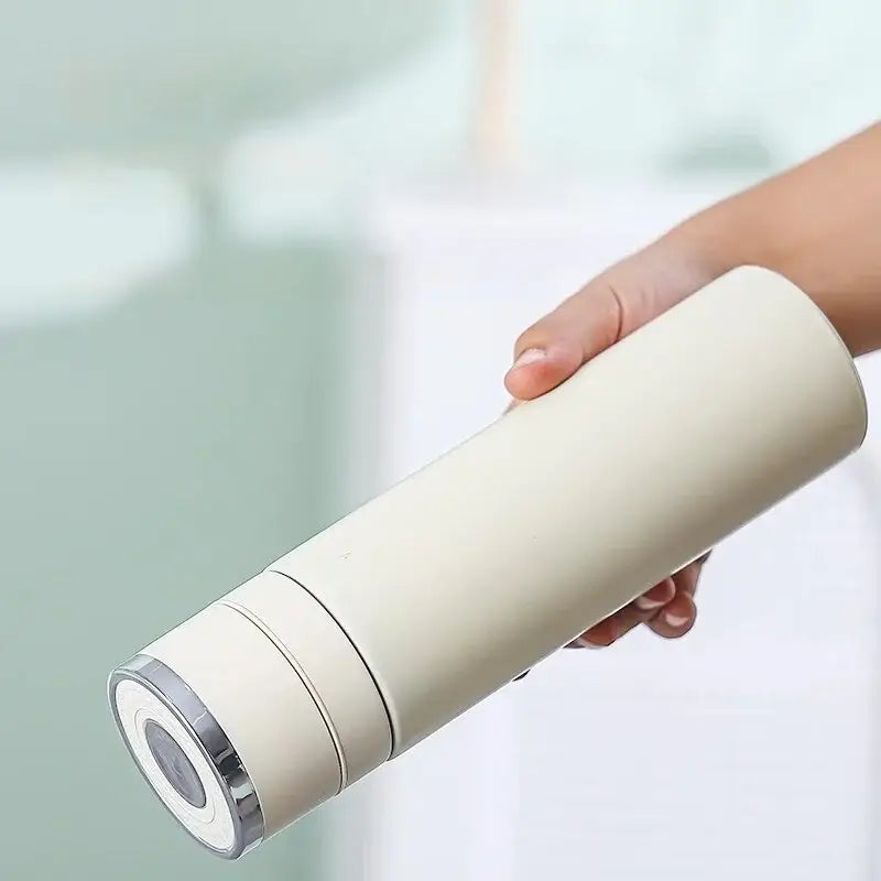 Cream-colored 400ml stainless steel vacuum travel mug with minimalist design and silver-toned lid for kitchen use
