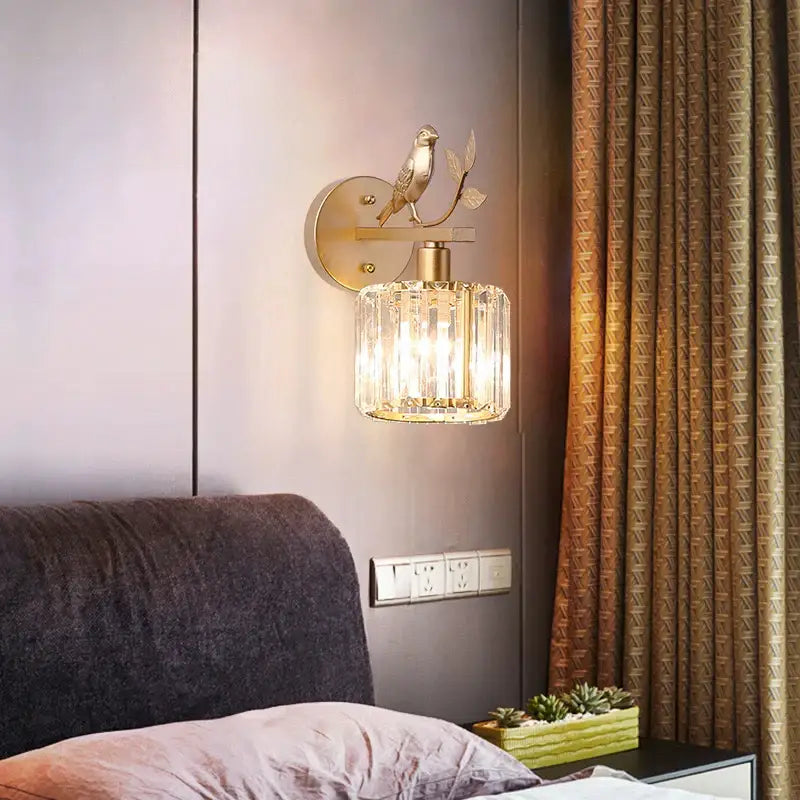 Modern black crystal bird wall lamp gold-toned sconce with detailed bird and cylindrical crystal shade by decorbites crystal bird