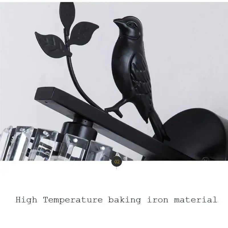 Modern black crystal bird wall lamp featuring a wrought iron bird perched on a leafy branch for elegant decorbites crystal bird wall decor