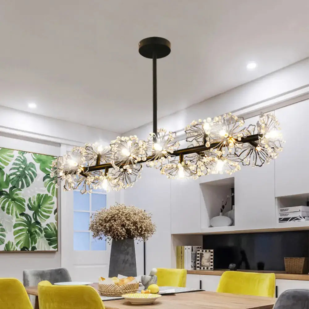 Modern black crystal blossom dining table light featuring intricate flower-like crystal clusters emitting warm light