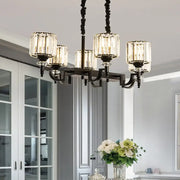 Elegant modern black ceiling light featuring a wrought iron chandelier with five clear crystal glass shades and adjustable cord length
