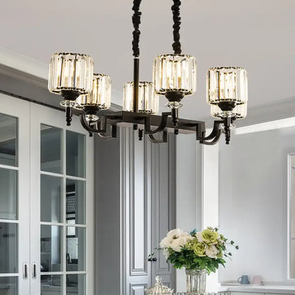 Elegant modern black ceiling light featuring a wrought iron chandelier with five clear crystal glass shades and adjustable cord length