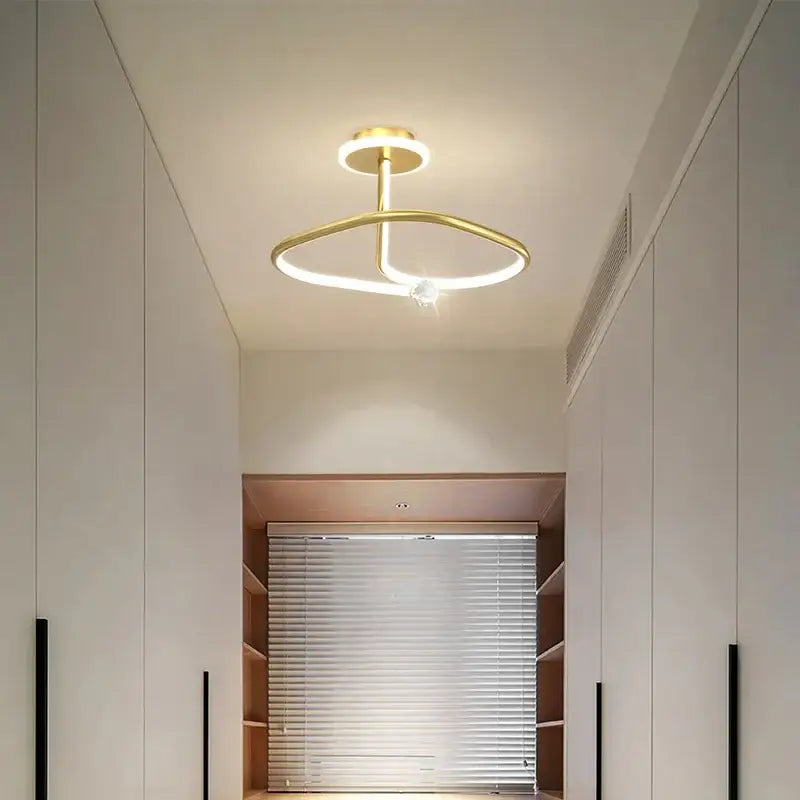 Modern black crystal chandelier with gold-toned interlocking rings and embedded crystal accent by decorbites black crystal