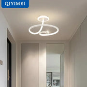 Modern black crystal chandelier featuring a white led ring light with sleek intertwined rings and central crystal by decorbites black crystal