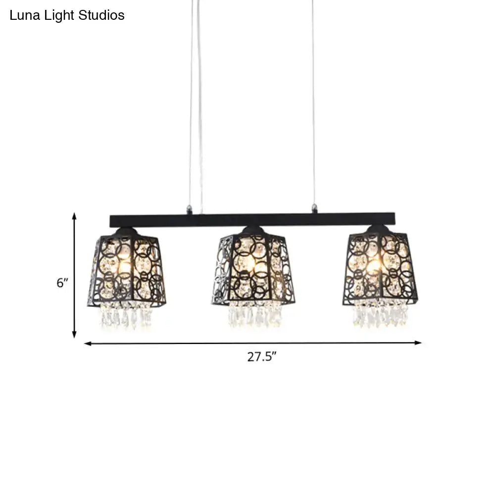 Black metal chandelier light fixture with three ornate circular shade shapes and crystal droplet accents for dining room