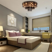 DecorBites modern black crystal flush mount chandelier with dark metal frame and cascading crystal strands for bedroom