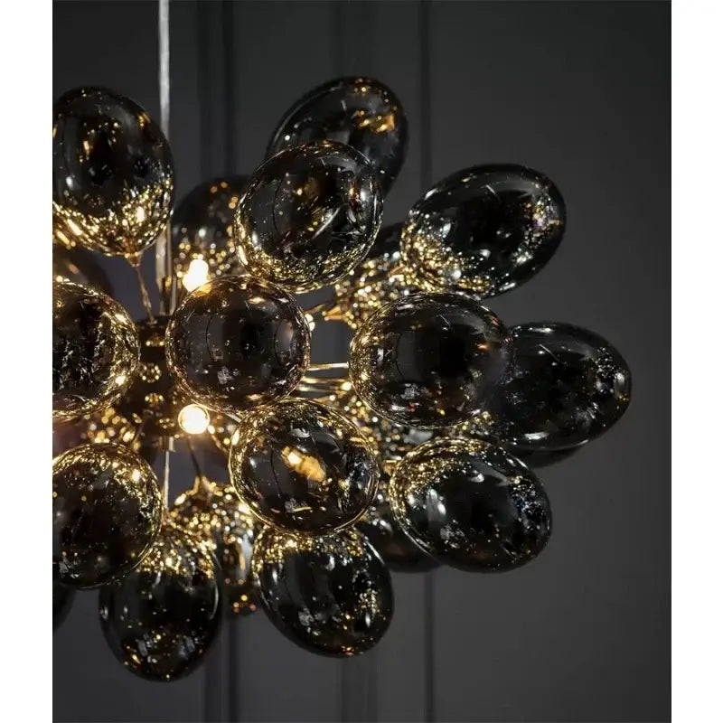 Modern black crystal grape chandelier with black glass globe and gold-toned metallic accents for dining room decorbites crystal grape