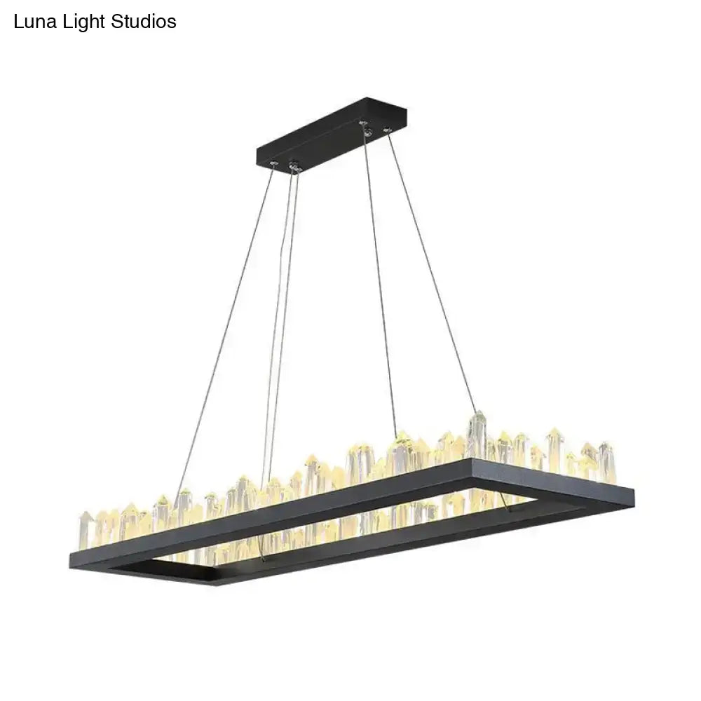 Black rectangular led ceiling light with clear crystal icicle rods emitting warm glow by DecorBites