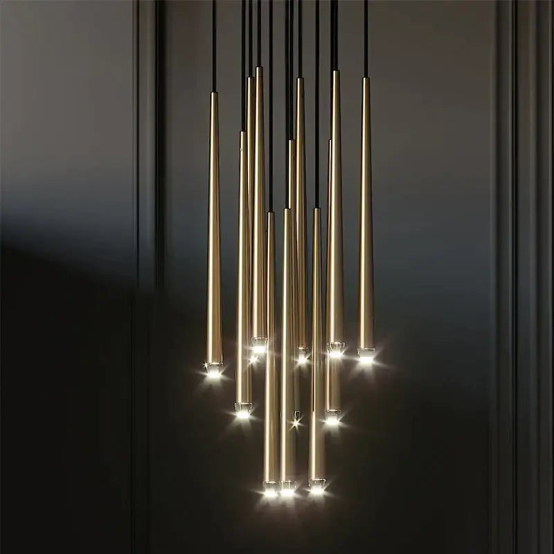 Modern black crystal led chandelier featuring gold-toned cylindrical pendant lights with warm glowing bulbs for dining room decorbites crystal led