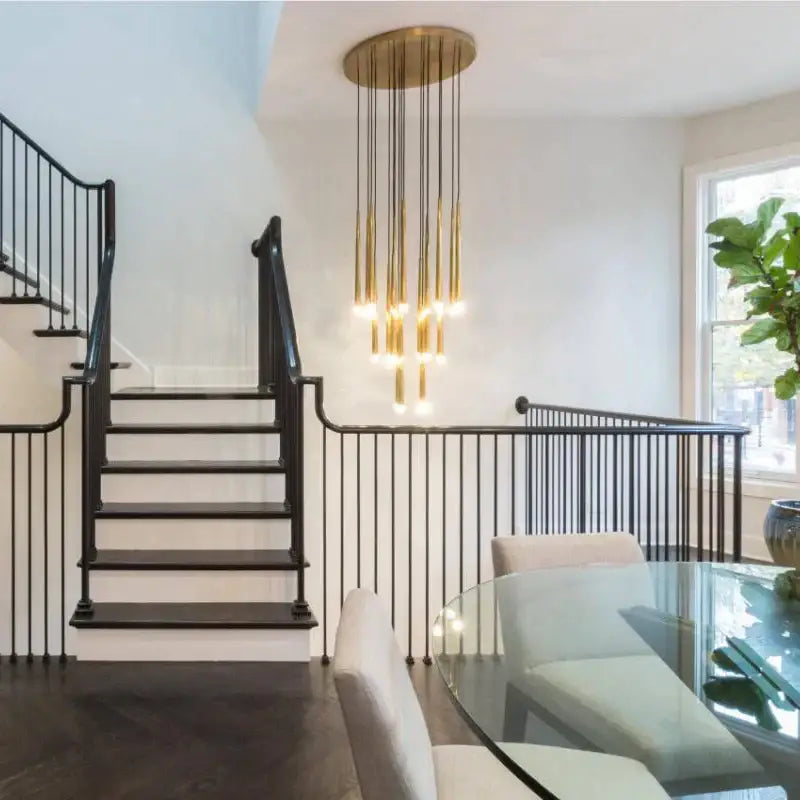 Modern gold-toned decorbites crystal led chandelier with slender rods and circular top for dining room pendant light decor