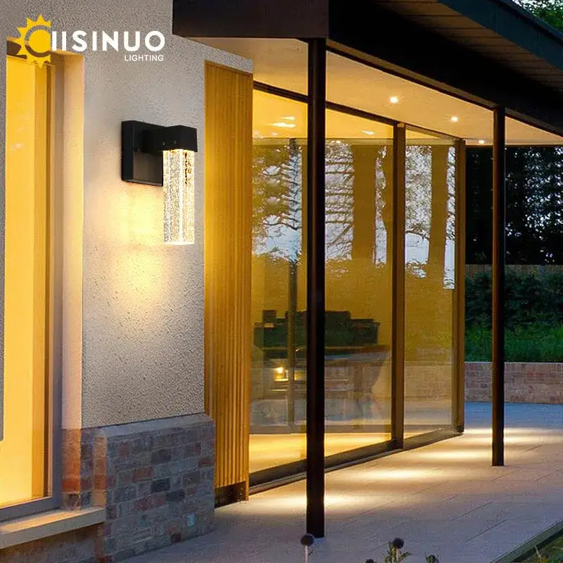 Modern black decorbites crystal led outdoor wall light with clear textured glass panel and warm yellow illumination