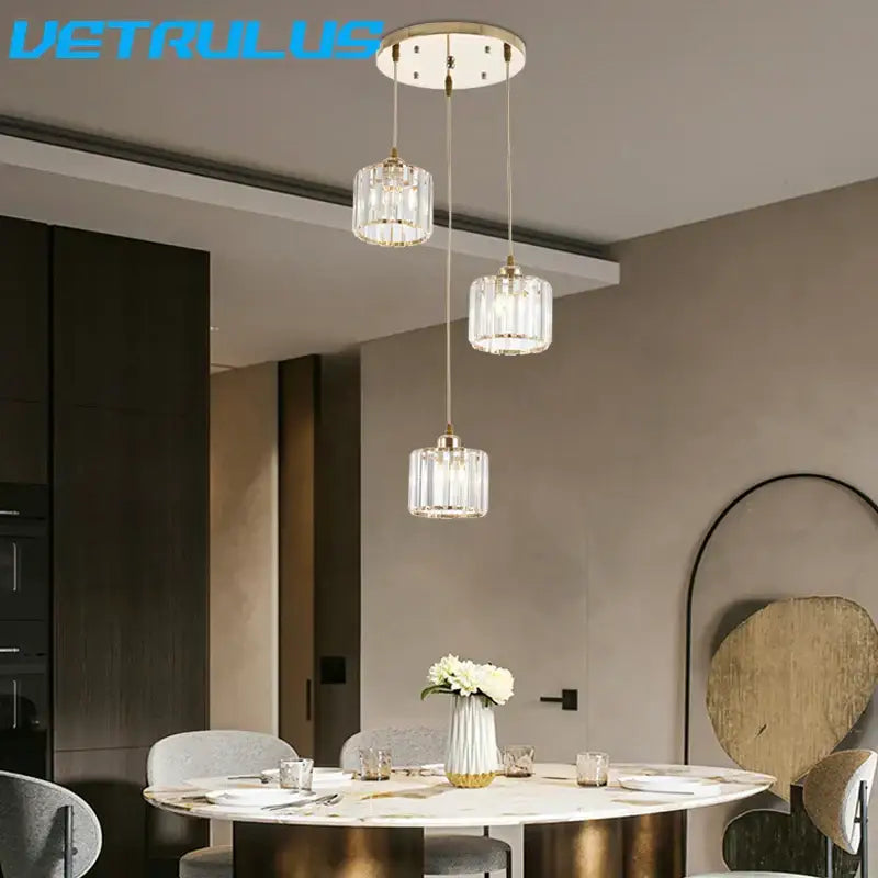 Three elegant black crystal led pendant chandelier lights with gold fixtures for dining room by decorbites crystal led