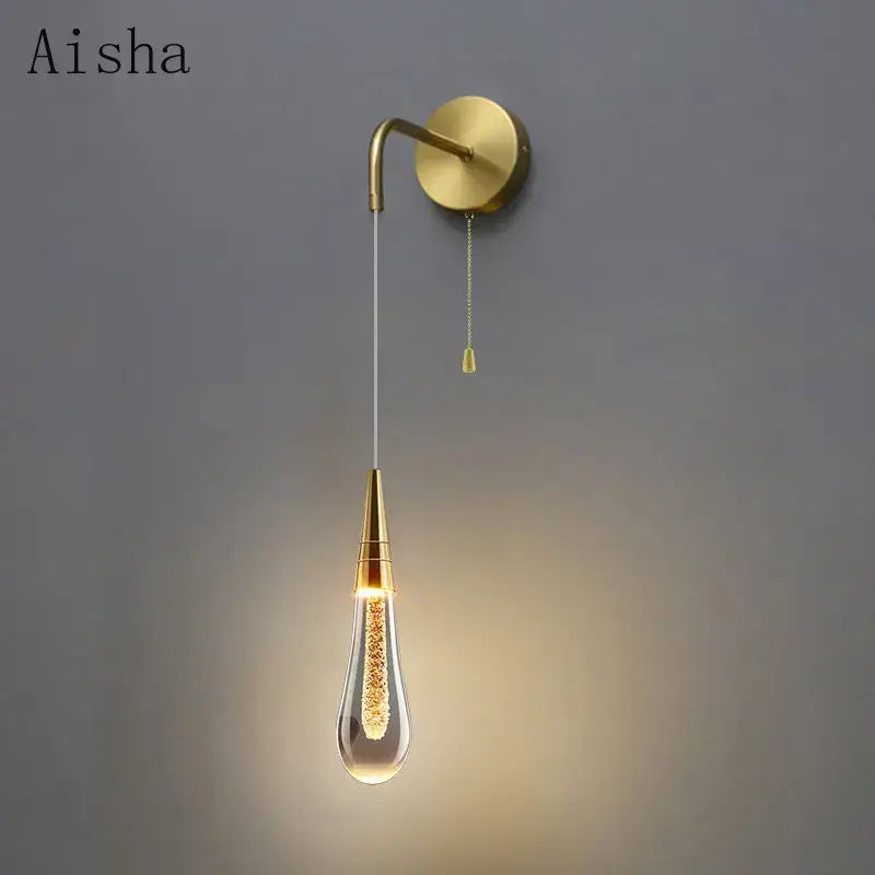 Modern black crystal led wall lamp with gold-toned teardrop glass bulb and brass-finished curved arm for decorbites crystal led wall decor