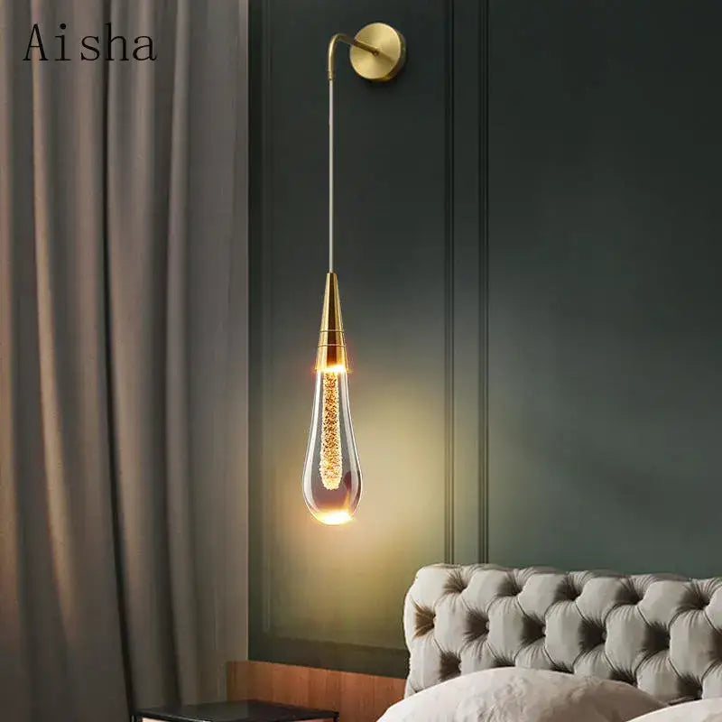 Modern black crystal led wall lamp with gold-finished teardrop sconce and decorbites crystal led filaments for bedroom decor
