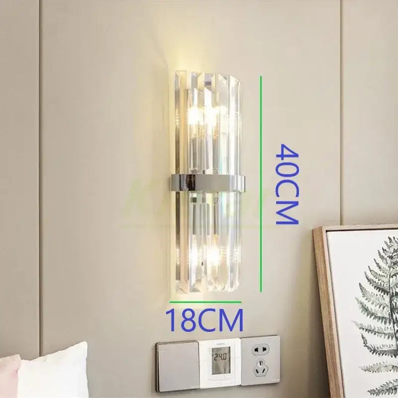 Modern black crystal led wall lights featuring clear crystal rods and sleek chrome accent bar for stylish bedroom decorbites crystal led