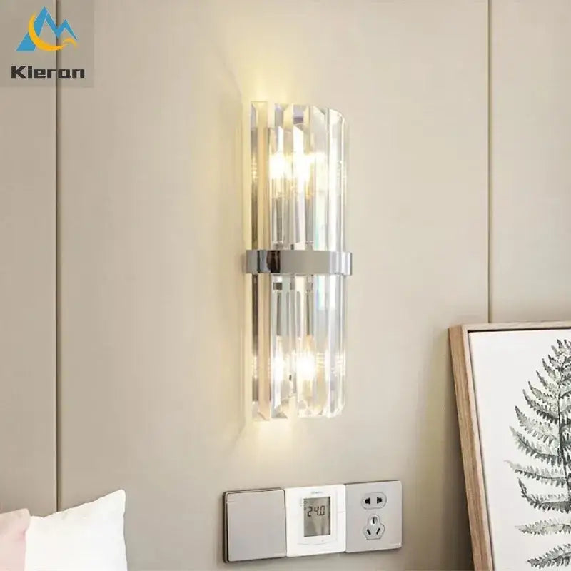 Modern black crystal led wall lights featuring clear crystal-like vertical bars and sleek chrome accent band for bedroom decorbites crystal led wall