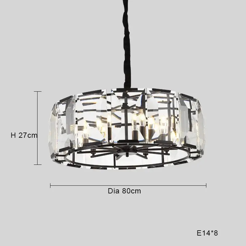 A modern black crystal pendant chandelier with clear faceted glass panels and a black metal frame for luxe dining room decor