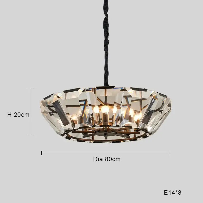 A modern black crystal pendant chandelier with faceted glass pieces and exposed metal frame for dining room luxe lighting