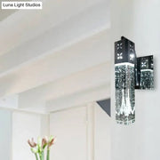 Modern black crystal rectangle wall sconce with clear bubble crystal rectangle and geometric cut-out patterns for bedroom light
