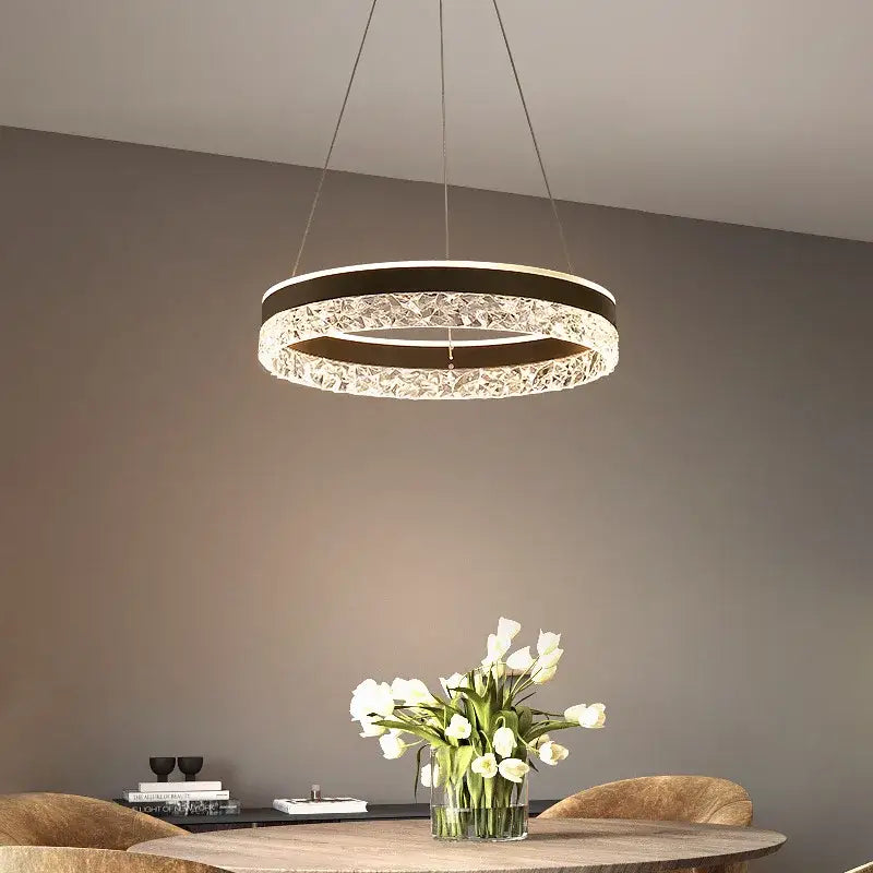 Modern black crystal ring led pendant light with a circular frame and sparkling crystal accents for bedroom decorbites lighting