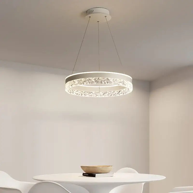 Modern white pendant light with decorbites crystal ring led and sleek metallic suspension for bedroom lighting