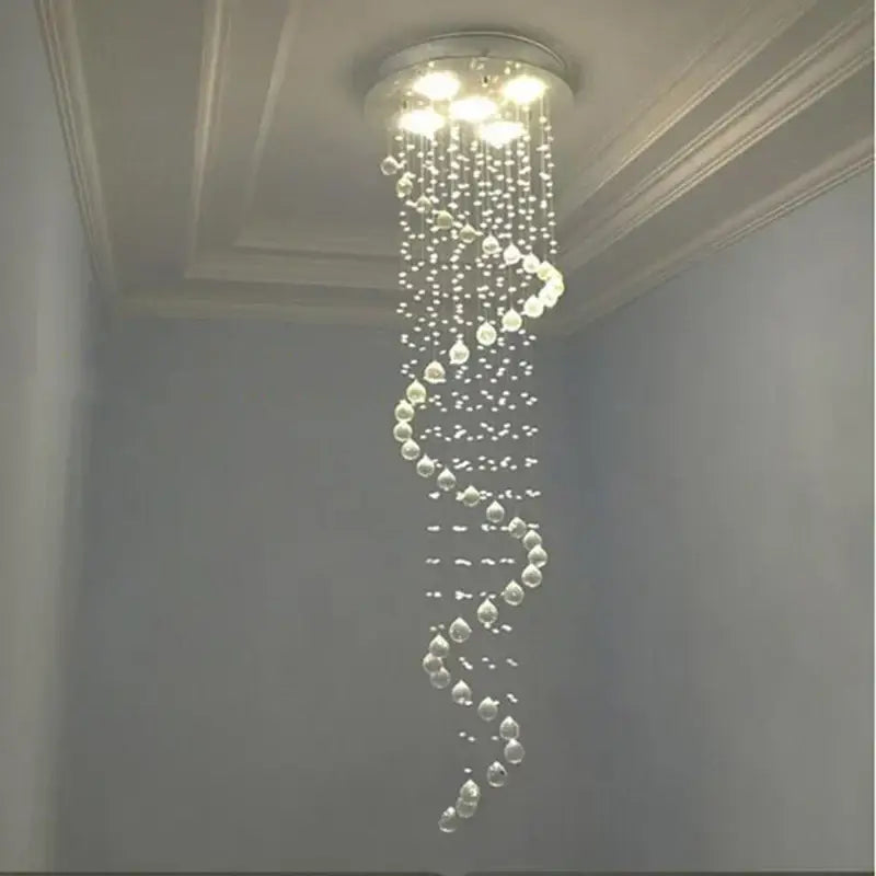Modern black crystal staircase chandelier with circular mount and cascading faceted beads decorbites crystal staircase