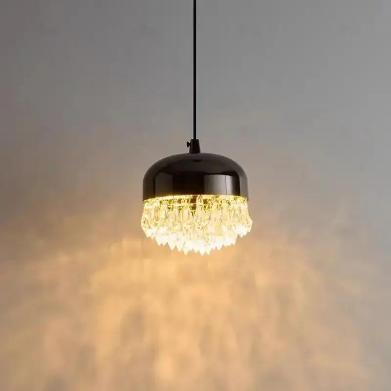 A sleek black crystal tassel chandelier pendant light with clear crystal droplets for modern bedroom decor