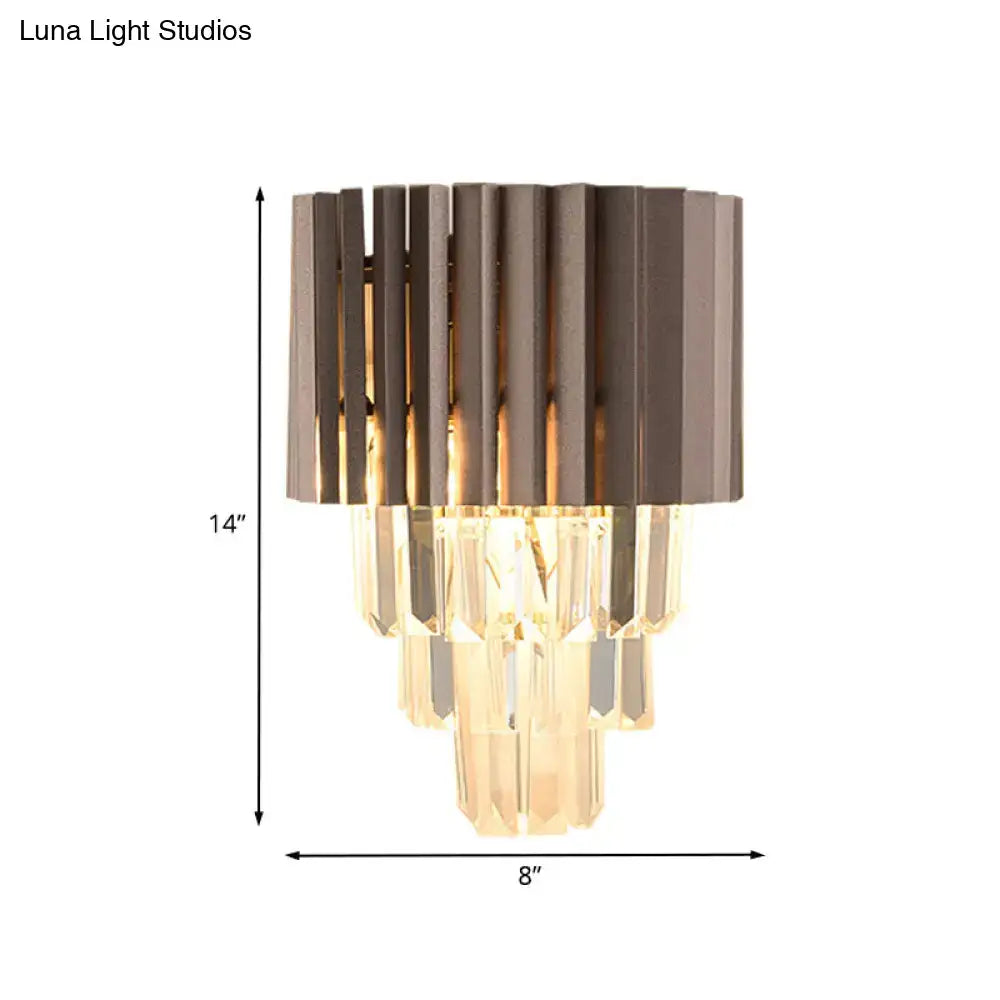 Modern black crystal wall light featuring a dark bronze metallic frame with cascading faceted crystal prisms for bedroom use