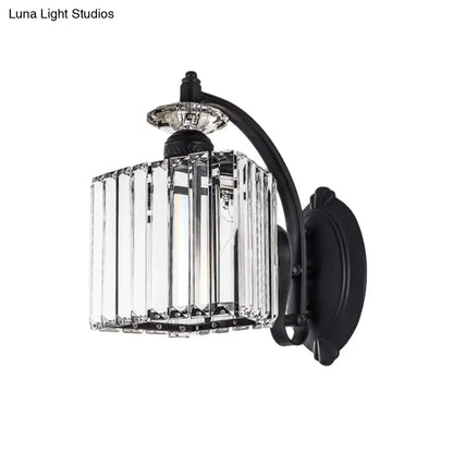 Modern black wrought iron wall light with clear faceted crystal cage and curved arm for living room decor