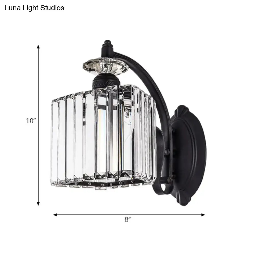 Modern black wrought iron wall light with clear crystal prisms and curved arm for living room in modern style