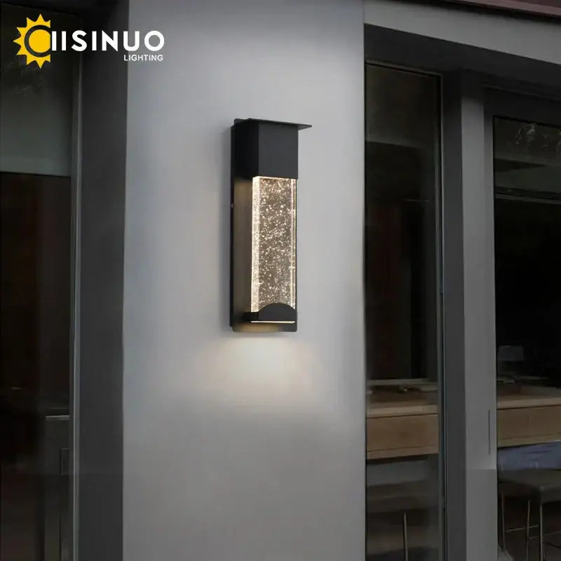 Modern black crystal wall light with pir motion sensor featuring a sparkling illuminated glass panel for outdoor use