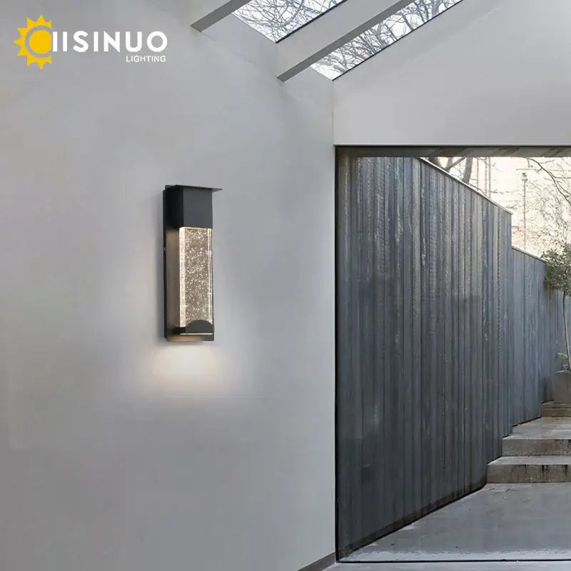 Modern black crystal wall light with pir motion sensor featuring a textured glass panel that diffuses warm light outdoors