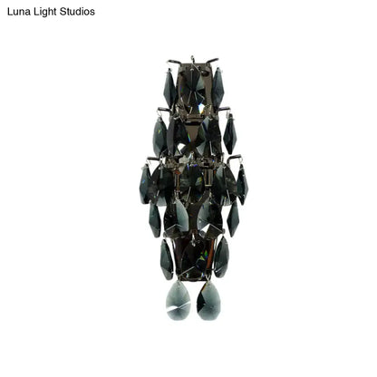 Elegant modern black crystal wall sconce with tiered faceted teardrop crystals for living room lighting fixture