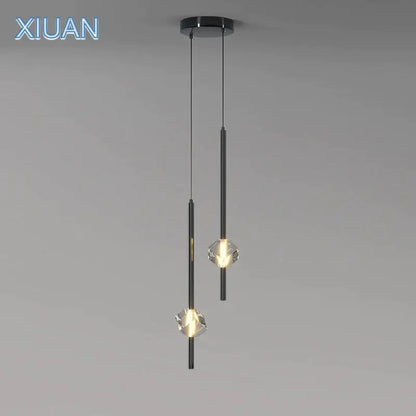 Modern black cube crystal pendant lamps feature crystal-like glass shades with sleek cylindrical metal rods for living room decorbites cube crystal lighting