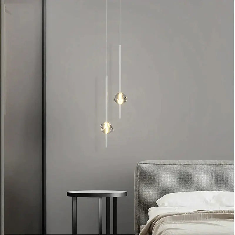 Modern black cube crystal pendant lamps with clear faceted glass shades and slender white cords for living room decorbites cube crystal