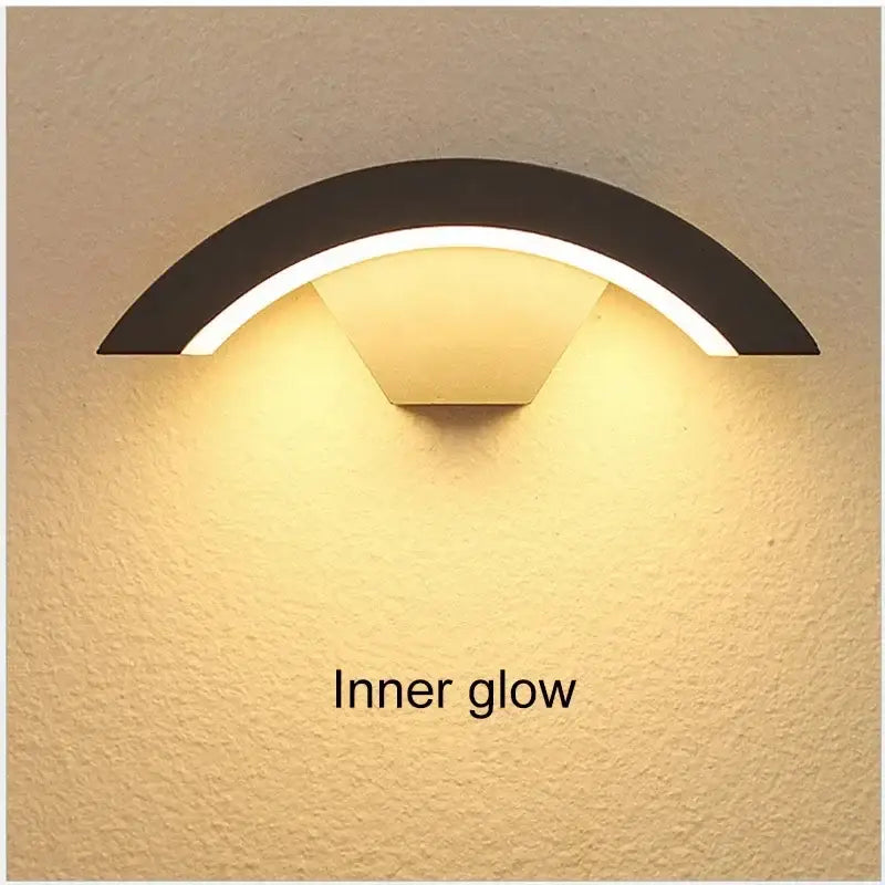 Modern black curved led waterproof outdoor wall lamp with warm inner glow and motion sensor by decorbites led waterproof