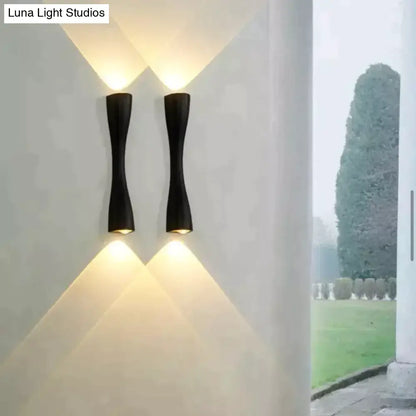 Modern black curved wall sconce outdoor waterproof porch light with sleek design and warm focused lighting