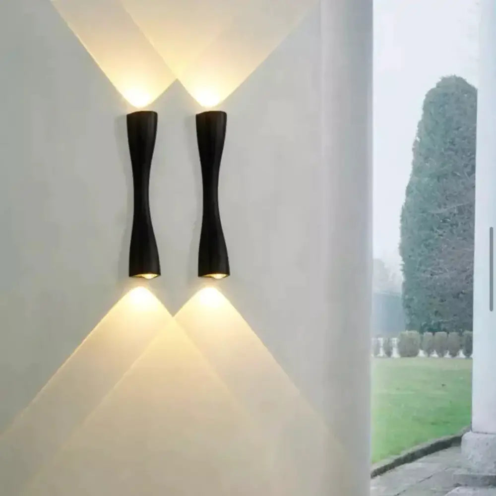 Modern black curved wall sconce outdoor waterproof porch light with sleek design and warm focused lighting