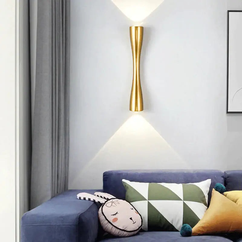 Modern black curved wall sconce outdoor waterproof porch light featuring a gold-toned sleek elongated sculptural design