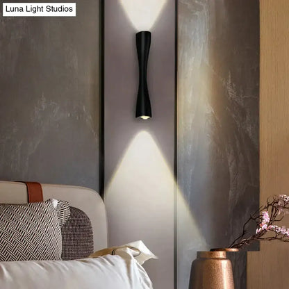 Modern black curved wall sconce featuring a sleek design for outdoor waterproof porch lighting