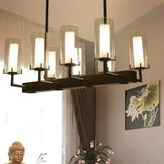 Modern black metal chandelier with cylinder clear glass shades for clear glass island lighting by DecorBites™