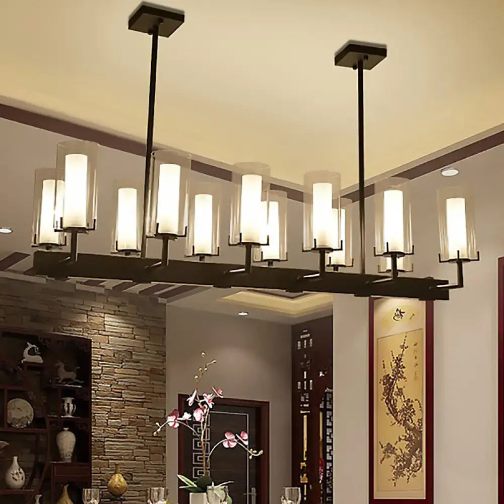 Modern black metal chandelier with multiple frosted cylinder clear glass shades for clear glass island lighting