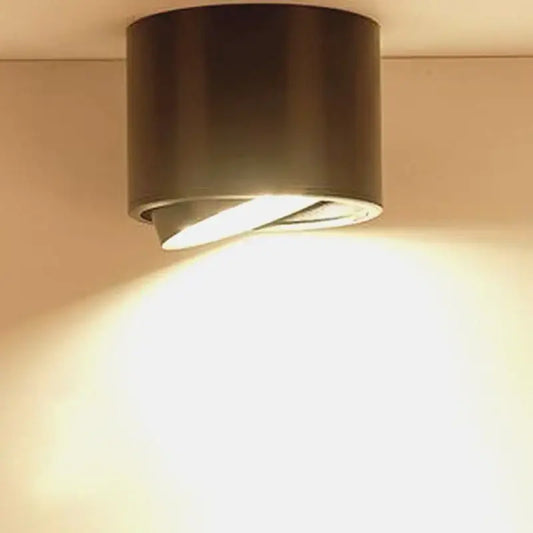 Modern black cylindrical dimmable ceiling spot light with warm focused beam ideal for kitchen downlight use