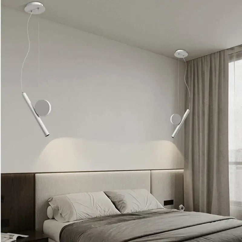 Modern white adjustable led pendant lamps with sleek cylindrical bodies hang symmetrically as pendant lamps decorbites